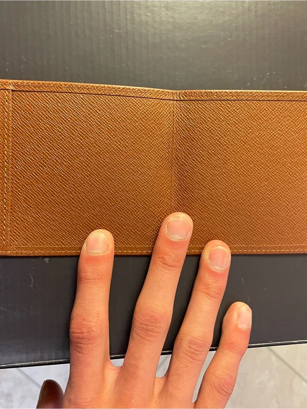 Authentic Louis Vuitton Wallet Card/Cash holder crafted from brown Taiga leather